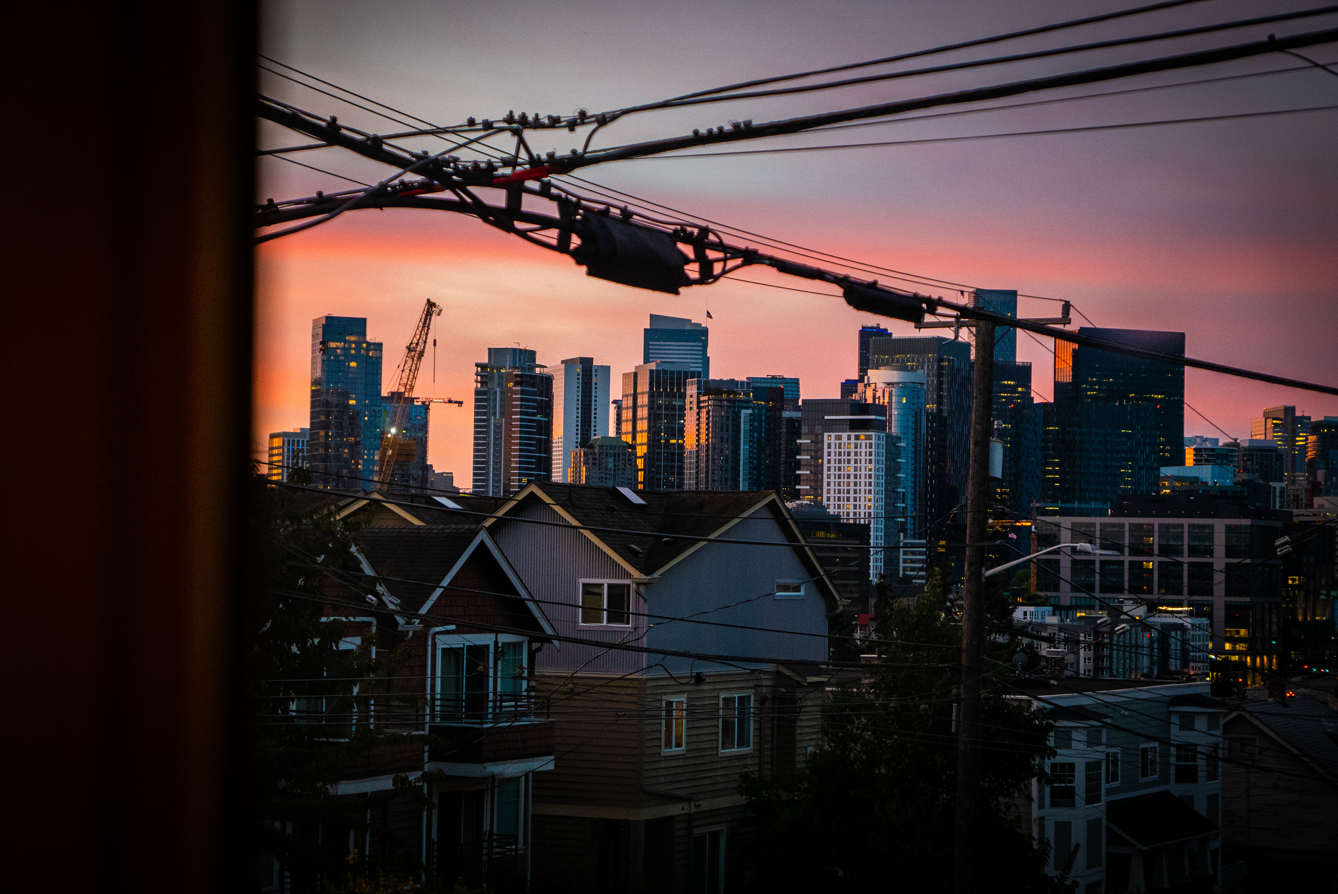 Seattle skyline at dawn through a window; Credit: Paco Jones